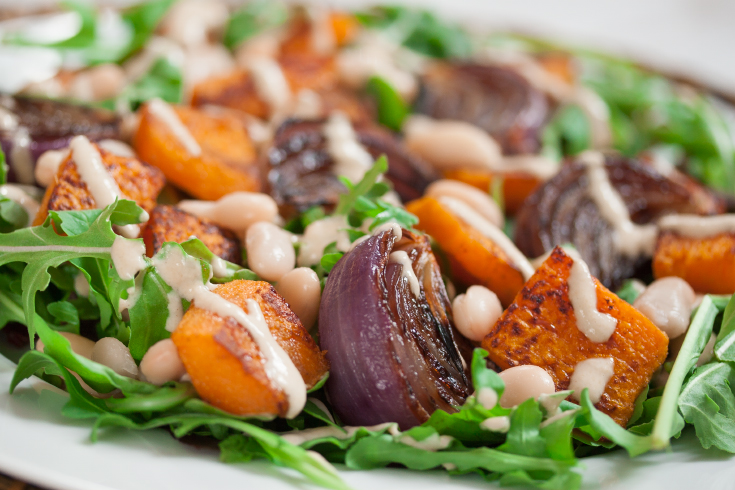 Roasted butternut squash salad with oil-free cashew dressing.