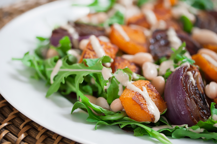 Roasted butternut squash salad with oil-free cashew dressing.