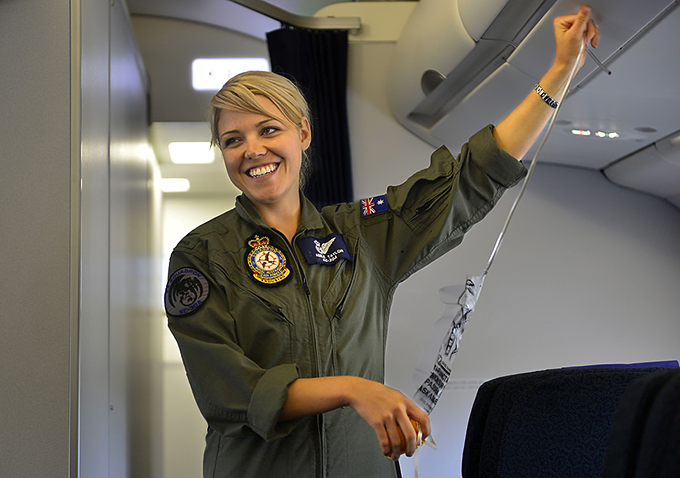 v3-1200px-RAAF_Aircraftswoman_providing_a_safety_brief_onboard_a_KC-30